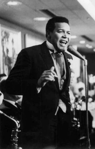 Chubby Checker smiling in a 1964 photograph, several years after his 1960 hit The Twist became a nationwide dance craze