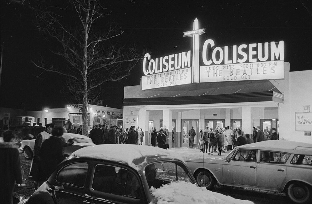 The Beatles performing on stage at the Washington Coliseum in February 1964, during their first American tour
