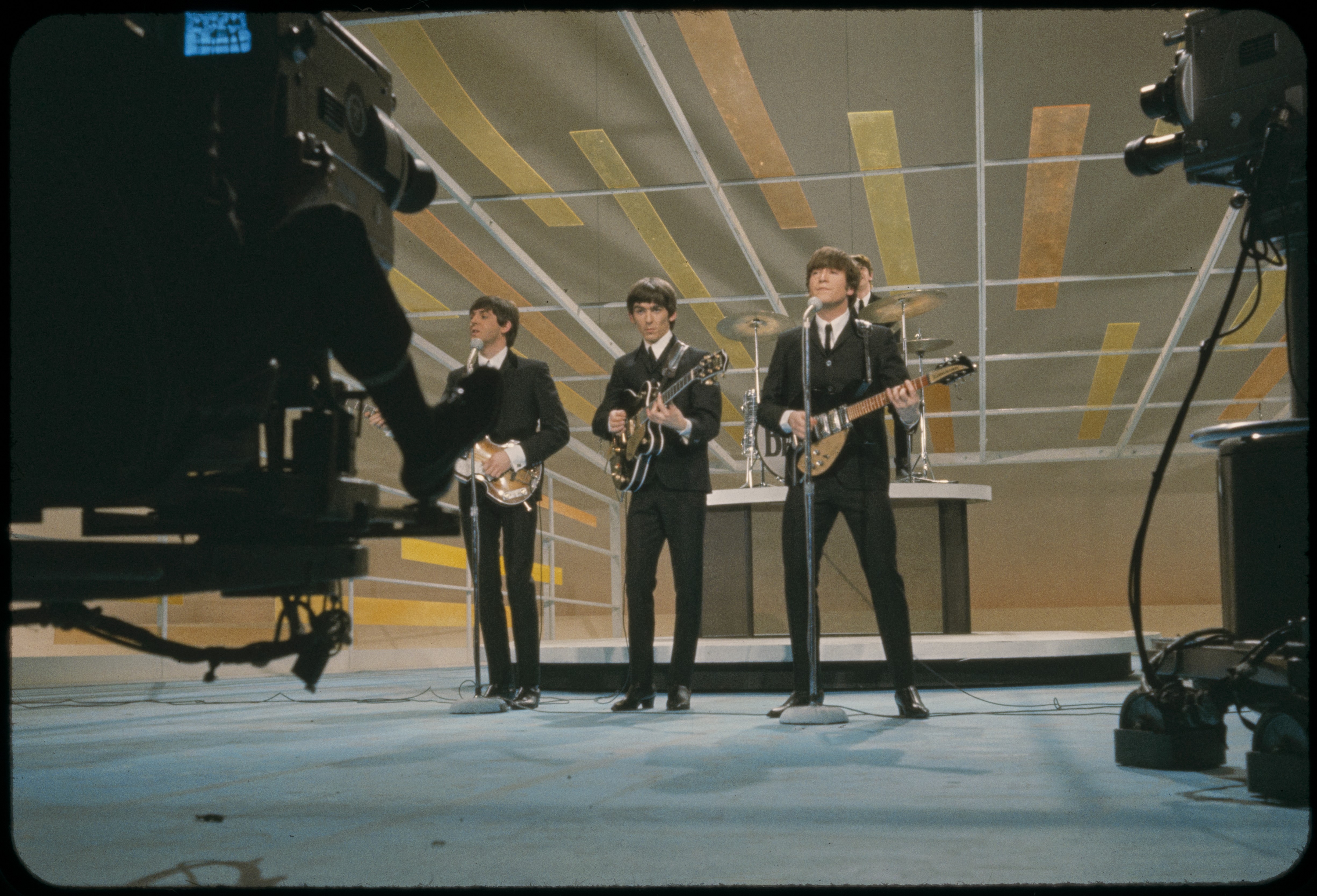 The Beatles performing on The Ed Sullivan Show stage, February 1964