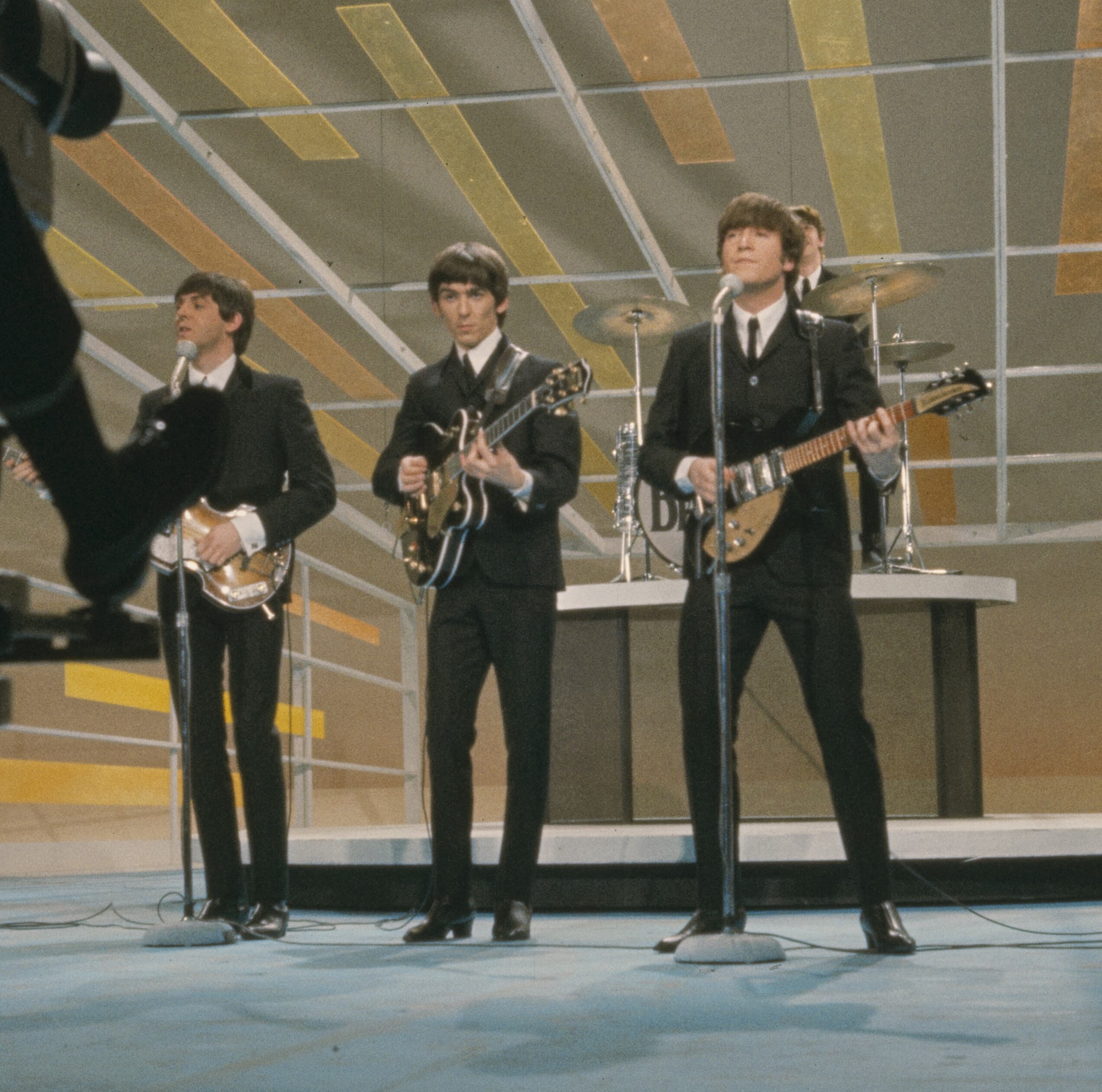 The Beatles performing on The Ed Sullivan Show stage, February 1964